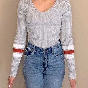 Full sleeved grey top with red/white stripes